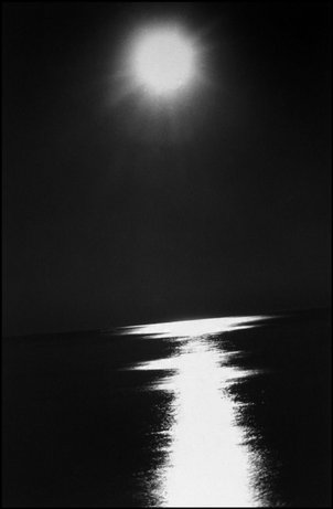The moon over the ocean (from a slate photo essay)