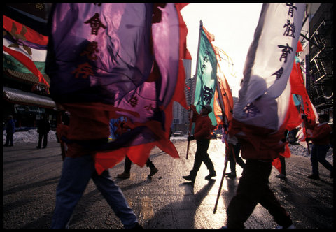 USA. New York City. 1996. Members of a Kung fu school march to celebrate Chinese New Year.